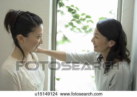 Mother and daughter talking View Large Photo Image Picture - Mother and daughter talking. Fotosearch