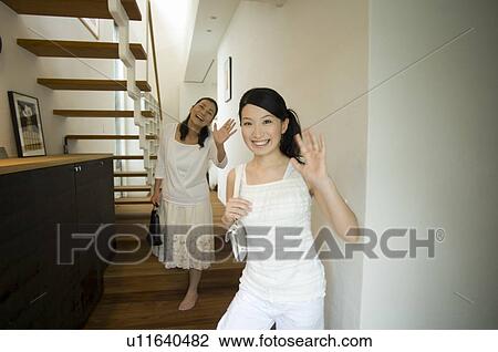 Mother and daughter waving hands View Large Photo Image Stock Image - Mother and daughter waving hands. Fotosearch