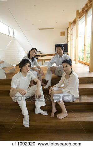 Stock Image - Portrait of a family with adult children. Fotosearch