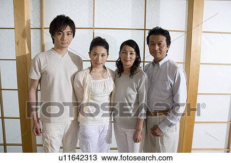 Stock Image - Portrait of a family with adult children. Fotosearch