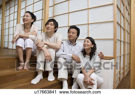 Stock Image - Portrait of a family with adult children. Fotosearch