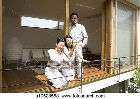 Stock Photo - Portrait of a family with adult children. Fotosearch