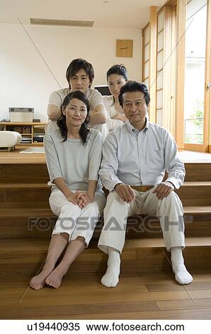 Stock Photography - Portrait of a family with adult children. Fotosearch
