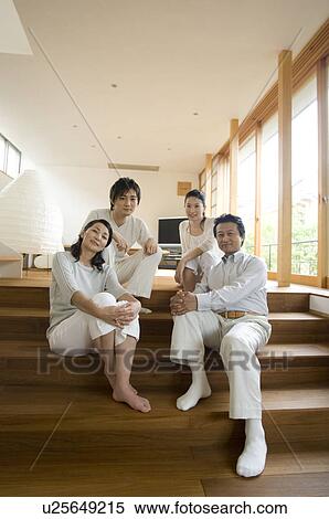Stock Photography - Portrait of a family with adult children. Fotosearch