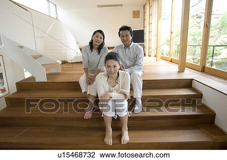 Stock Image - Portrait of a family with adult daughter. Fotosearch