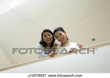 Stock Photo - Portrait of mother and daughter. Fotosearch