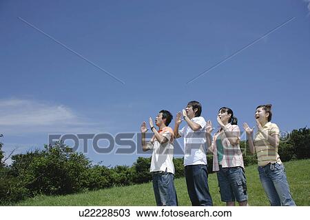 Four young people yelling View Large Photo Image Stock Image - Four young people yelling. Fotosearch