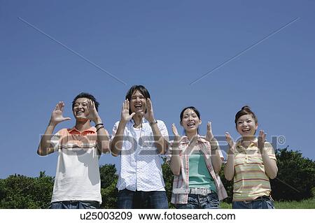 Stock Photo - Four young people yelling. Fotosearch