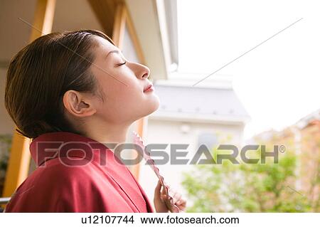 Picture - Portrait of a young woman wearing kimono. Fotosearch