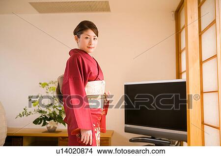 Picture - Portrait of a young woman wearing kimono. Fotosearch