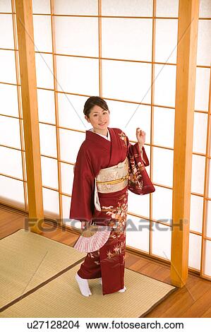 Picture - Portrait of a young woman wearing kimono. Fotosearch