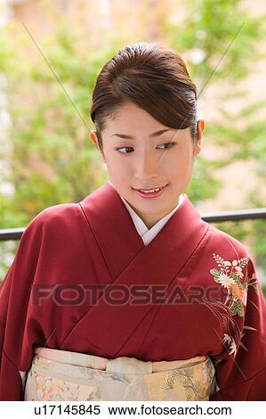 Portrait of a young woman wearing kimono View Large Photo Image Stock Photography - Portrait of a young woman wearing kimono. Fotosearch