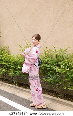 Picture - Portrait of a young woman wearing yukata. Fotosearch