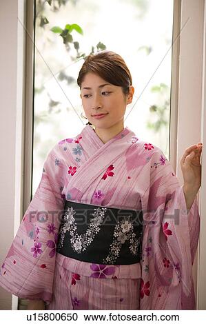 Portrait of a young woman wearing yukata View Large Photo Image Stock Image - Portrait of a young woman wearing yukata. Fotosearch