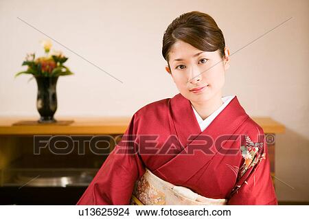 Portrait of young woman wearing kimono View Large Photo Image Picture - Portrait of young woman wearing kimono. Fotosearch