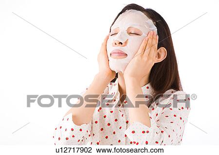 A woman applying facial mask View Large Photo Image Stock Image - A woman applying facial mask. Fotosearch