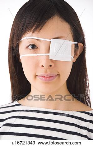 A woman wearing eye patch View Large Photo Image Stock Photo - A woman wearing eye patch. Fotosearch