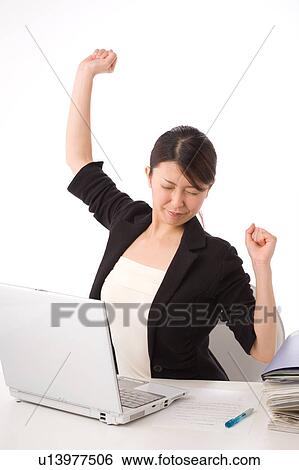 A young woman stretching View Large Photo Image Stock Photograph - A young woman stretching. Fotosearch