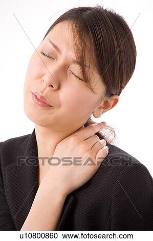 A young woman suffering from pain on shoulder View Large Photo Image Stock Image - A young woman suffering from pain on shoulder. Fotosearch