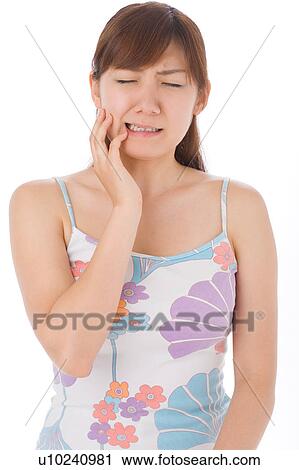 A young woman suffering from toothache View Large Photo Image Stock Image - A young woman suffering from toothache. Fotosearch