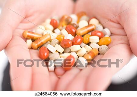 Woman's hand holding pills View Large Photo Image Stock Photograph - Woman's hand holding pills. Fotosearch