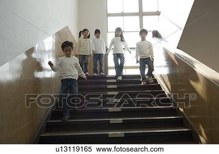 Children descending staircase View Large Photo Image Stock Photography - Children descending staircase. Fotosearch