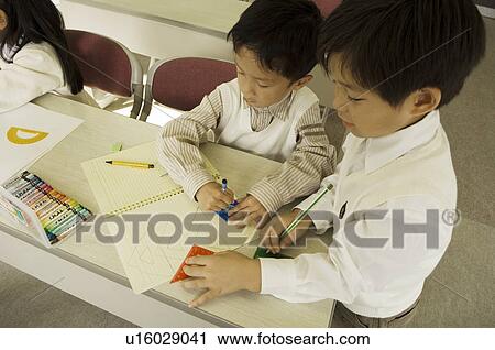 Stock Image - Children drawing picture. Fotosearch