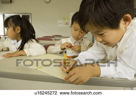 Stock Image - Children drawing picture. Fotosearch