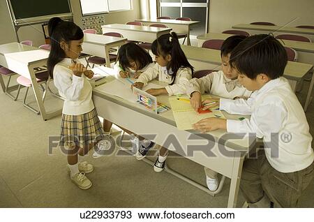 Stock Image - Children drawing picture. Fotosearch
