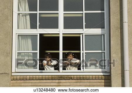 Children looking out of window at school View Large Photo Image Stock Image - Children looking out of window at school. Fotosearch