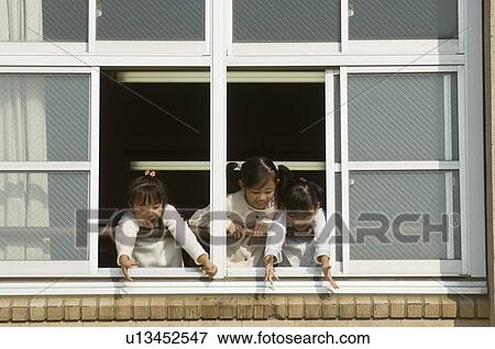 Children looking out of window at school View Large Photo Image Stock Photo - Children looking out of window at school. Fotosearch