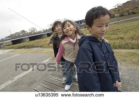 Children playing in park View Large Photo Image Stock Photography - Children playing in park. Fotosearch