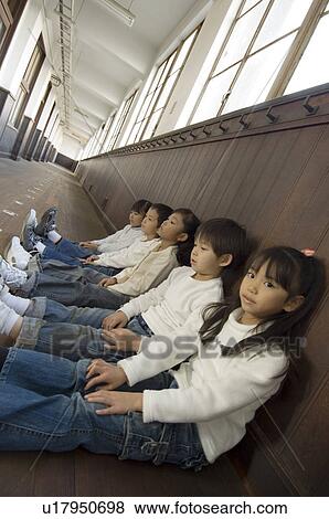 Children sitting in corridor View Large Photo Image Stock Photo - Children sitting in corridor. Fotosearch