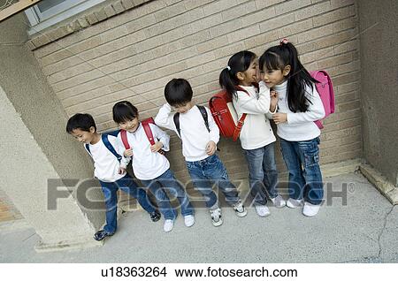 Children standing in a row View Large Photo Image Picture - Children standing in a row. Fotosearch