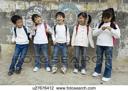 Children standing in a row View Large Photo Image Stock Image - Children standing in a row. Fotosearch
