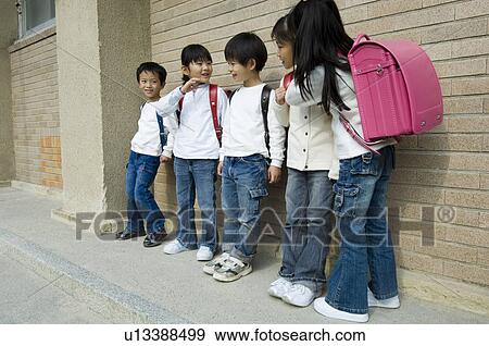 Children standing in a row View Large Photo Image Stock Photo - Children standing in a row. Fotosearch