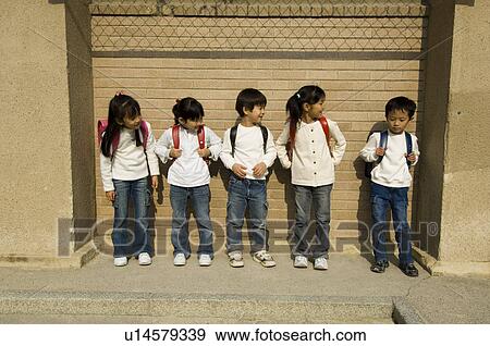 Children standing in a row View Large Photo Image Stock Photo - Children standing in a row. Fotosearch