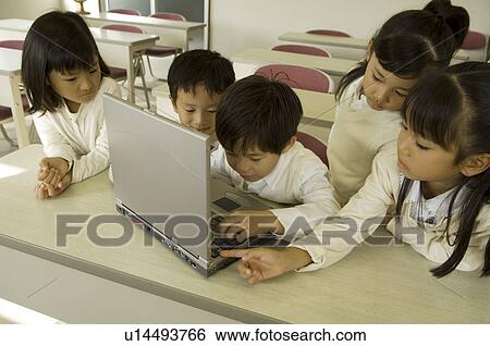 Stock Photograph - Children using computer. Fotosearch