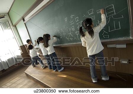 Children writing on blackboard View Large Photo Image Stock Image - Children writing on blackboard. Fotosearch