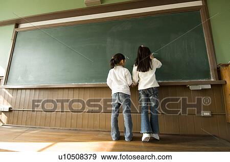 Children writing on blackboard View Large Photo Image Stock Photo - Children writing on blackboard. Fotosearch