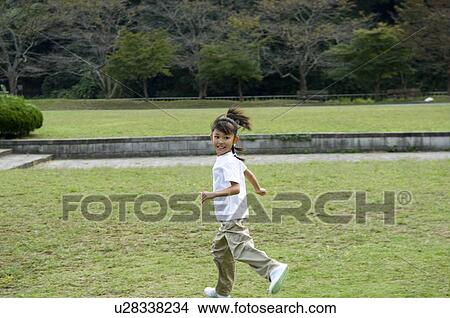 Girl running in park View Large Photo Image Picture - Girl running in park. Fotosearch