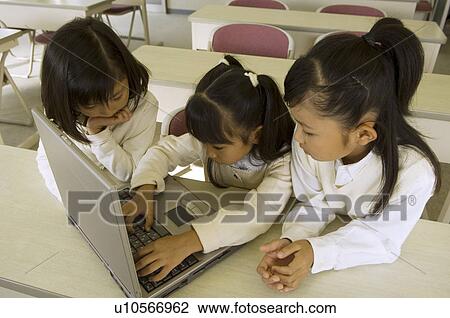 Girls using computer View Large Photo Image Stock Image - Girls using computer. Fotosearch