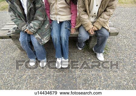 Stock Photo - Low section of children sitting. Fotosearch
