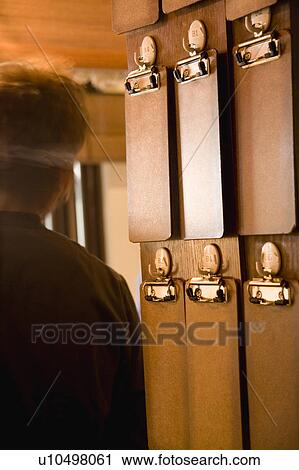 Blank order files hanging on wall View Large Photo Image Stock Image - Blank order files hanging on wall. Fotosearch