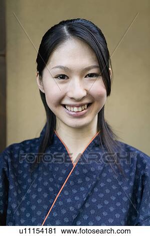 Portrait of young woman smiling View Large Photo Image Stock Image - Portrait of young woman smiling. Fotosearch