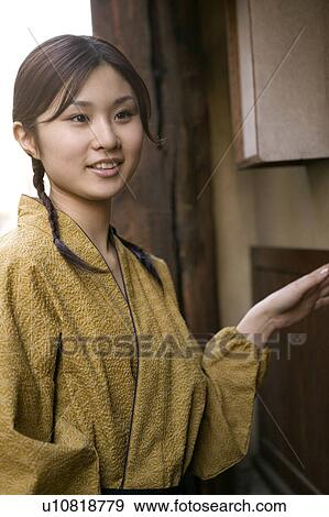 Stock Photo - Portrait of young woman smiling. Fotosearch