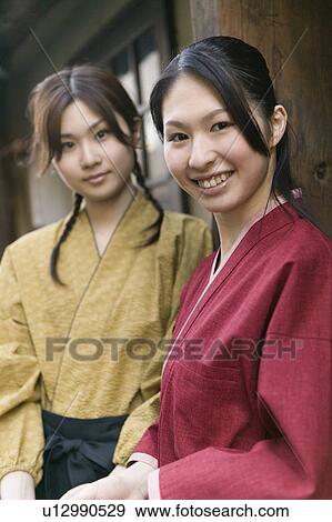 Stock Photo - Portrait of young woman smiling. Fotosearch