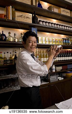 Stock Photography - Bartender mixing drink. Fotosearch