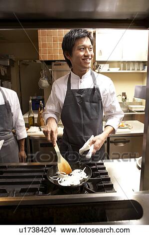 Picture - Chef cooking in restaurant kitchen. Fotosearch