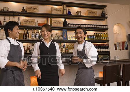 Chefs and waitress talking View Large Photo Image Stock Image - Chefs and waitress talking. Fotosearch